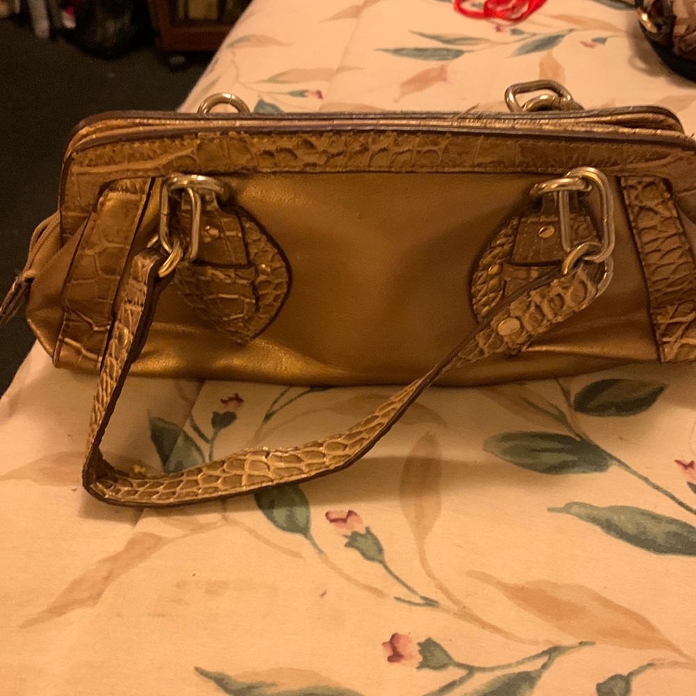 Small bag by Worthington. Gold color. In good condition